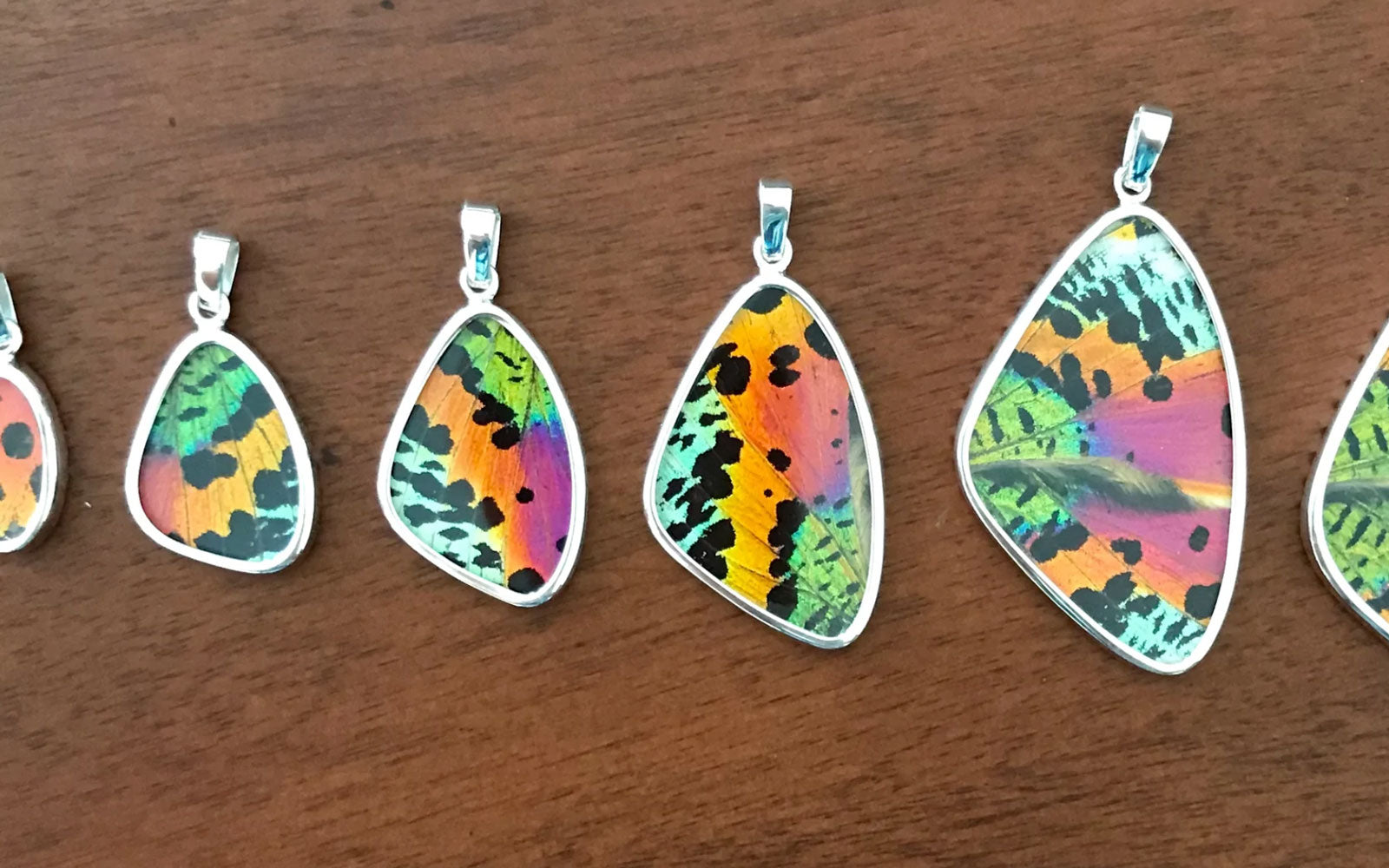 Different sizes of butterfly wing pendants