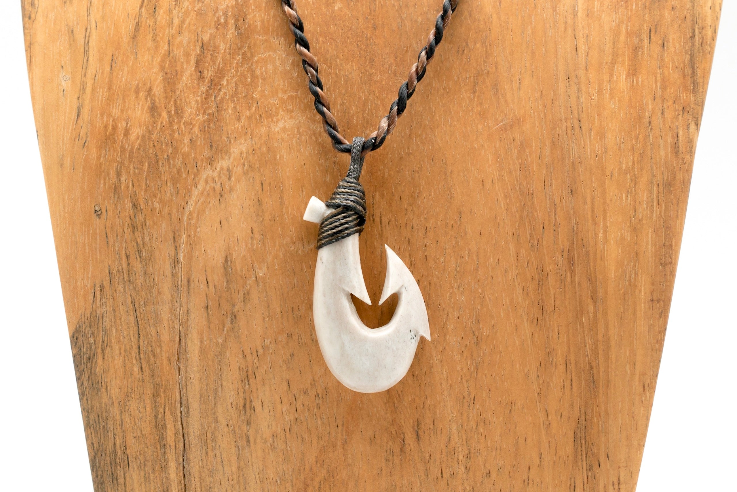 antique hawaiian bone fish hook Old English Engraved Makau (Hawaiian Hook) Pendant in 14K White or Pink Gold This Buffalo Bone Hawaiian Makau with black engravings This craftsman is keeping an