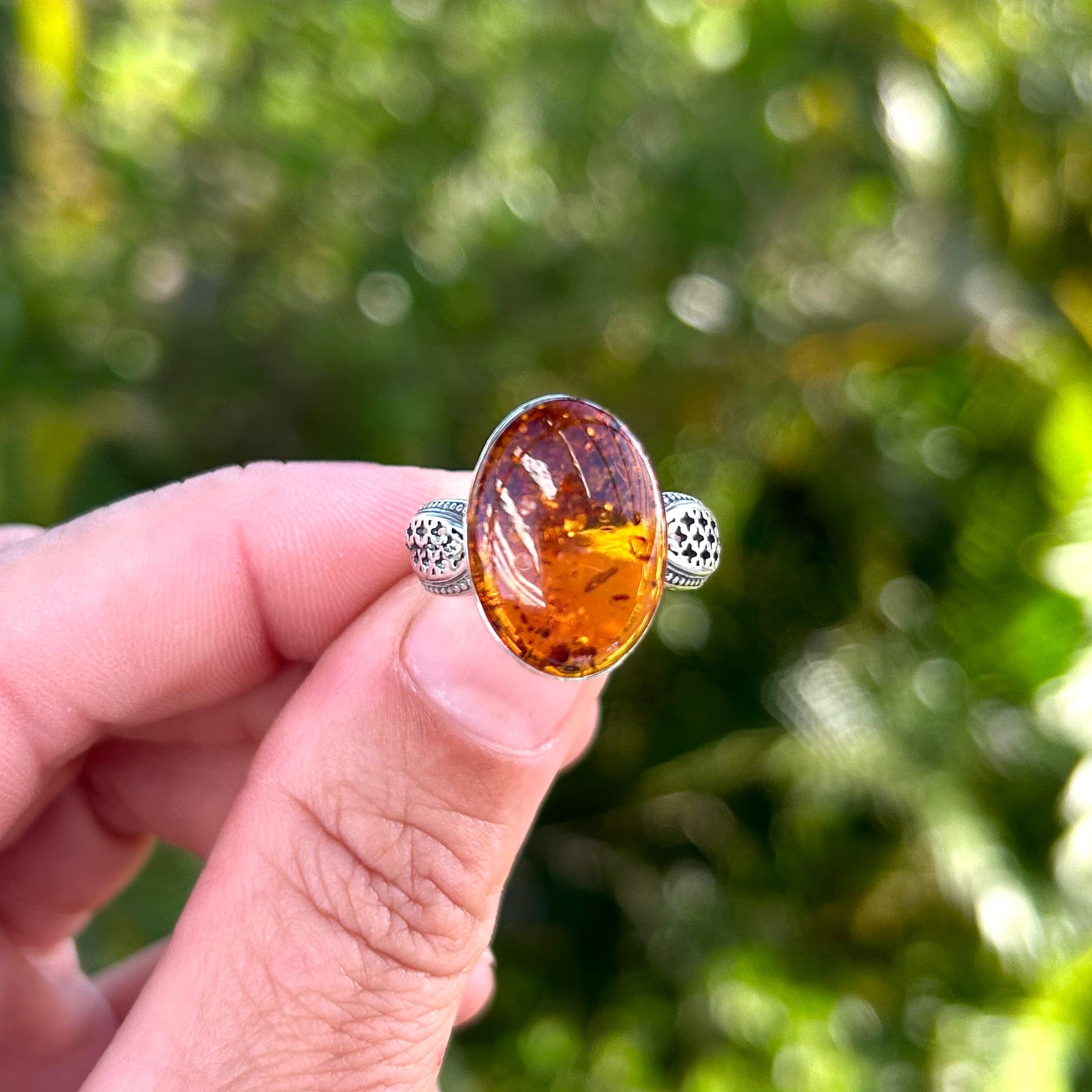 Baltic Amber Ring with Decorative Cutout Design