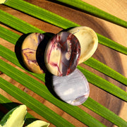 Mookaite Jasper Worry Stones on Palm Leaf