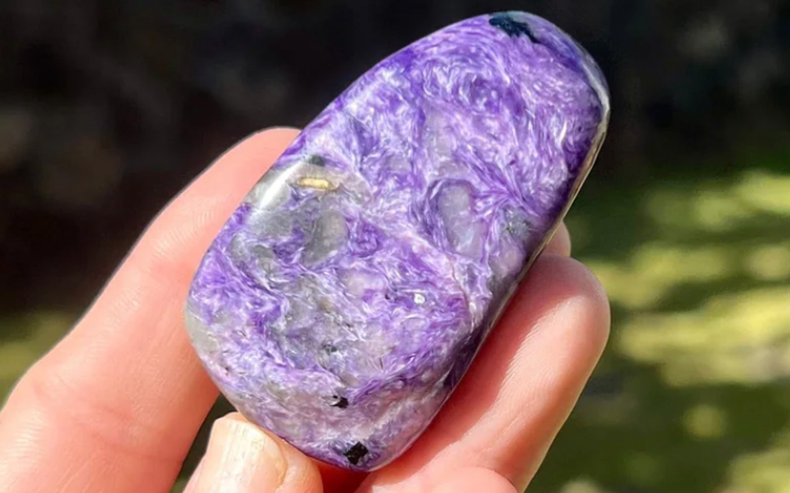 Person holding Charoite freeform healing stone