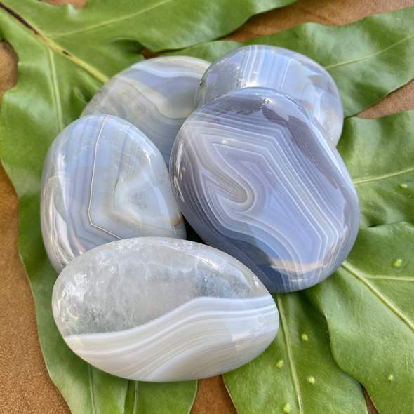 Banded agate palm stones