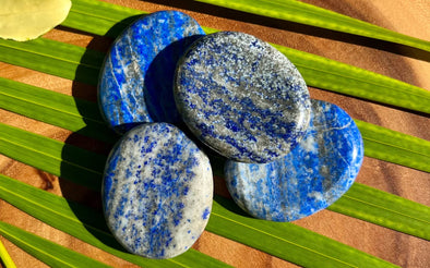 Lapis Lazuli Worry Stones on Palm Leaf
