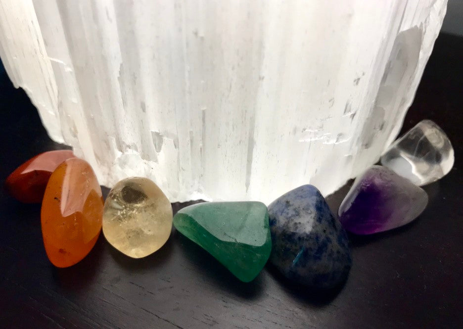 Chakra stones arranged around a piece of selenite