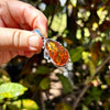 Person Holding Baltic Amber Sterling Silver Pendant