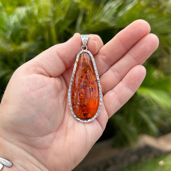 Elongated Baltic Amber Pendant Set in Sterling Silver Frame
