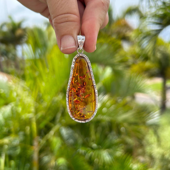 Elongated Baltic Amber Pendant with Botanical Inclusions