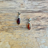Sterling Silver Baltic Amber Pendants on Wood