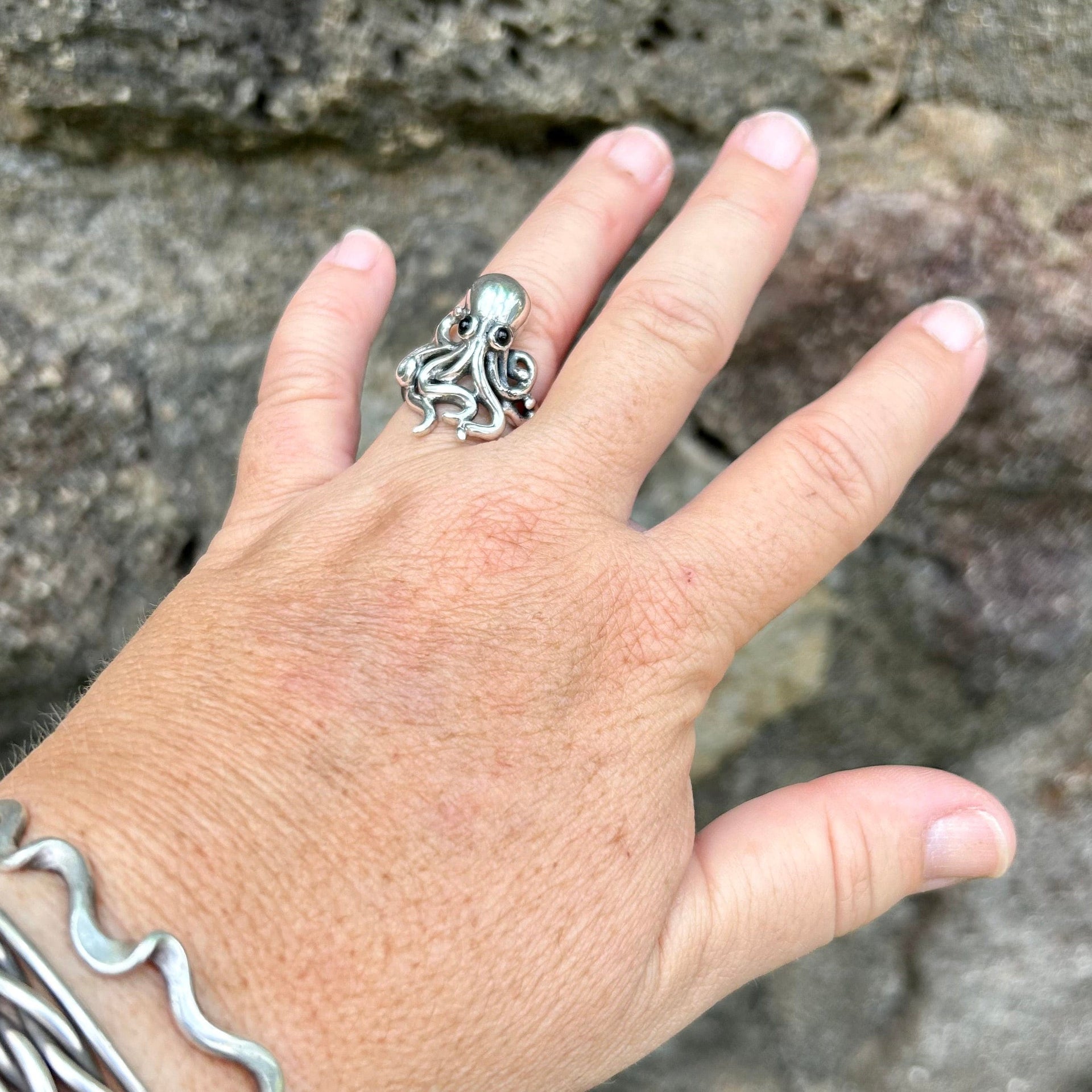 Model wearing hand crafted Adjustable Octopus Ring with Black Onyx Eyes 