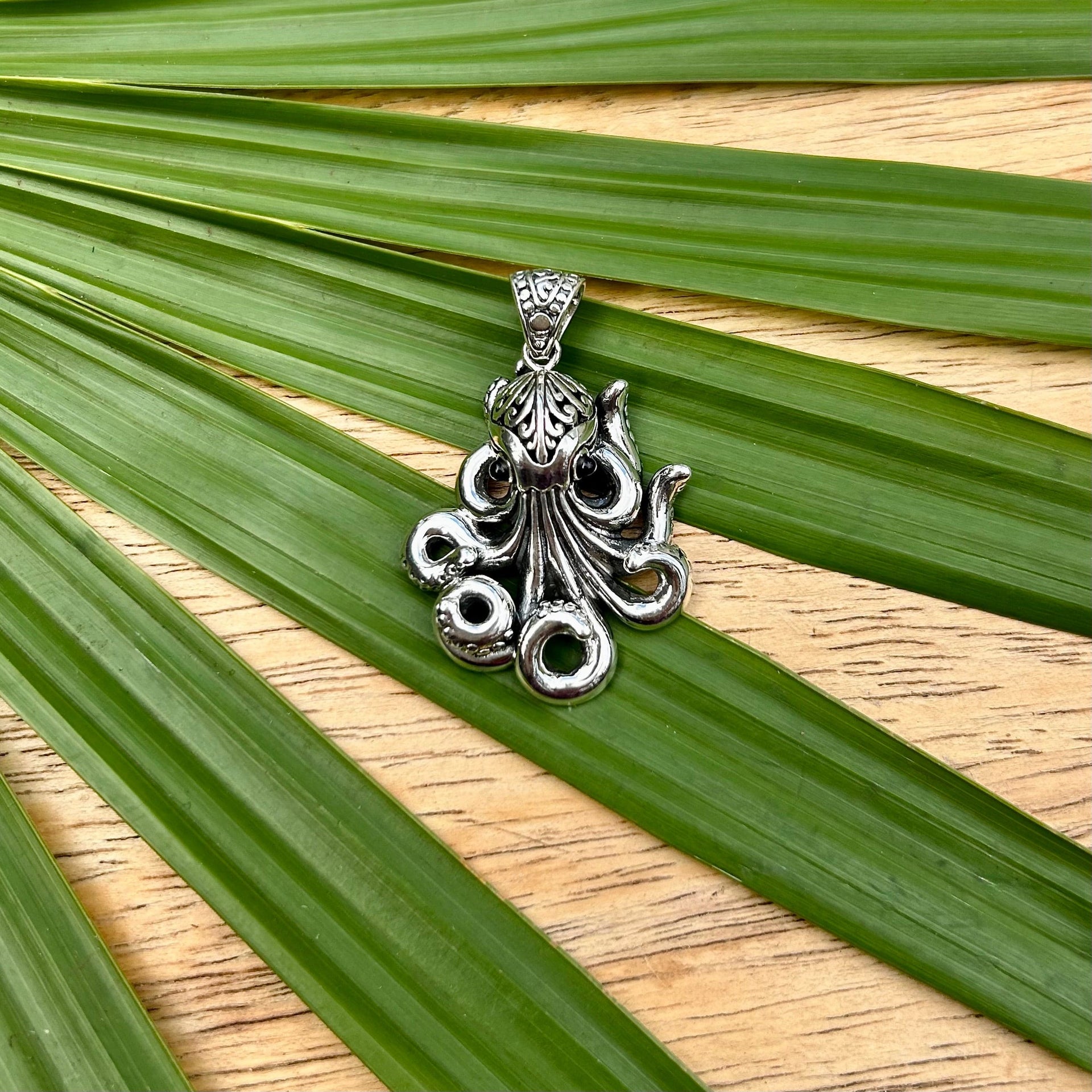 Octopus with Filagree Pendant on Palm Leaf