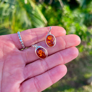 Two Baltic Amber Carved Rose Pendants