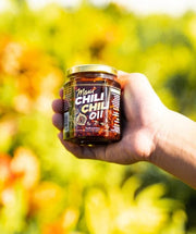 Glass bottle of Mild Kine Spicy Maui Hawaiian Chili Oil