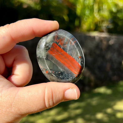 Person Holding Bloodstone Worry Stone
