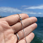 Simple Yet Elegant Silver Box Chain With Rounded Links and Lobster Claw Style Clasp Displayed on Palm of Hand